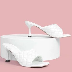 Size 10 White women’s slip on heel